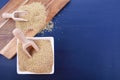 White grain quinoa on blue wood background.