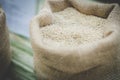 white grain rice in burlap sack bag Royalty Free Stock Photo