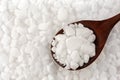 White granulated Dishwasher salt to soften water, Salt in wooden