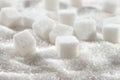 White granulated sugar and refined sugar cubes close-up Royalty Free Stock Photo