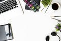 White graphic designer desk table with pen mouse, laptop and supplies. Top view with copy space, flat lay