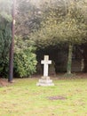 white gravestone cemetery grass close up graveyard cross english Royalty Free Stock Photo