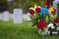 White gravestones and flowers at cemetary for memorial day Royalty Free Stock Photo