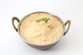 White gravy malai kofta in a copper brass bowl