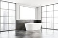 White and gray bathroom corner with tub and poster Royalty Free Stock Photo