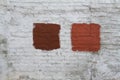 White-gray brick wall with red painted splotch Royalty Free Stock Photo