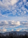 White and gray clouds in a blue sky with foreground Royalty Free Stock Photo