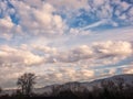 White and gray clouds in a blue sky with foreground Royalty Free Stock Photo