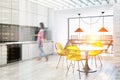 White and gray kitchen and a dining room side blur Royalty Free Stock Photo