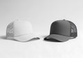 Two mesh back baseball caps displayed side by side against a neutral background Royalty Free Stock Photo