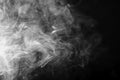 Gray, white smoke in the dark on a black background, isolated steam, fume, dry ice Royalty Free Stock Photo