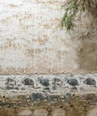 White gray wavy lines rustic tropical texture pattern on cement and boulder rock Asian traditional house wall surface background Royalty Free Stock Photo