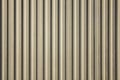 White gray yellow old dirty wall with vertical lines and shadows. rough surface texture Royalty Free Stock Photo