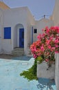 White greek bungalow with pink flowers Royalty Free Stock Photo