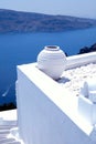 White greek pot on white terrace, Oia, Santorini, Cyclades, Gree Royalty Free Stock Photo
