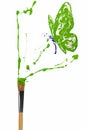 White and green painted butterfly hover above bursting paint paintbrush