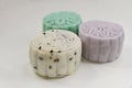 White, green & purple mini snow skin mooncakes with black sesame, green tea & taro yam paste fillings respectively