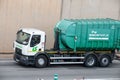 White and green Renault D series garbage truck driving along the Ronda Litoral in Barcelona