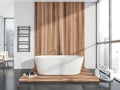 White and grey bathroom with wood look bathtub area Royalty Free Stock Photo