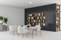 White and grey dining room corner with bookcase Royalty Free Stock Photo