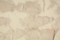 White grey old wall with shabby damaged plaster Cement and brick background of an vintage dirty exfoliating plaster Textured Royalty Free Stock Photo