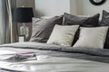 White and grey pillows on bed