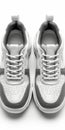 White and Grey Sneakers on White Background Royalty Free Stock Photo