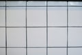 White grid tile wall. Background for wallpaper, patter and tile texture. Empty kitchen or toilet interior room