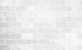 White grunge brick wall texture background for stone tile block painted in grey light color wallpaper modern interior and exterior Royalty Free Stock Photo