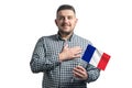 White guy holding a flag of France and holds his hand on his heart isolated on a white background With love to France Royalty Free Stock Photo