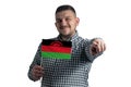 White guy holding a flag of Malawi and points forward in front of him isolated on a white background Royalty Free Stock Photo
