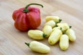 White habaneros and red habanero on bamboo cutting board Royalty Free Stock Photo