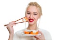 White-haired girl eating sushi