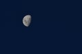 White half moon in dark blue sky evening night nature outdoors background atmospheric environment Royalty Free Stock Photo