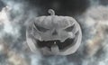 White Halloween pumpkin dark sky stormy fog mist background