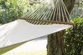 A white hammock clamped between two olive trees. The hammock looks cozy. Detail. Royalty Free Stock Photo