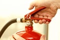 Hand presses the trigger fire extinguisher Royalty Free Stock Photo