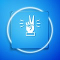 White Hand showing two finger icon isolated on blue background. Victory hand sign. Blue square button. Vector Royalty Free Stock Photo