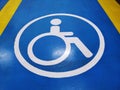 White Handicapped Parking Symbol on Blue Floor Royalty Free Stock Photo