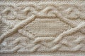 White handmade knitwork with horizontal braid pattern