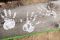 White hands paint prints on wood Royalty Free Stock Photo