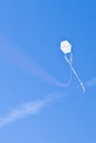 White hang-glider at a blue sky and clouds Royalty Free Stock Photo
