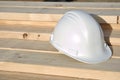 White Hard Hat on Lumber Royalty Free Stock Photo