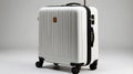 White Hard Shell Suitcase with Four Wheels and Black Zippers in Studio Setting Royalty Free Stock Photo