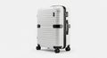 White Hardshell Rolling Suitcase with Black Accents and Combination Lock luggage travel Royalty Free Stock Photo
