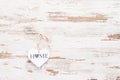 White hart on vintage retro wooden background with text Home