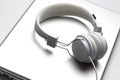 White headfones on laptop. Royalty Free Stock Photo