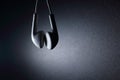 White earphone with blue light on dark background Royalty Free Stock Photo