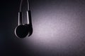 White earphone with violet light on dark background Royalty Free Stock Photo