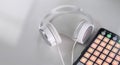 White headphones and beatbox on a gray background Royalty Free Stock Photo